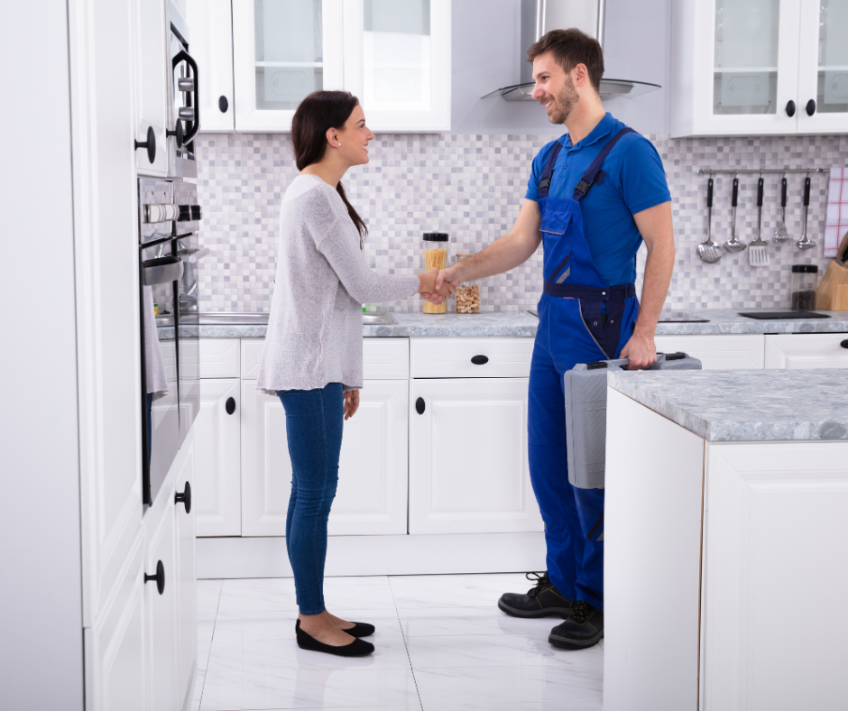 Westover plumber shaking hands with a satisfied customer